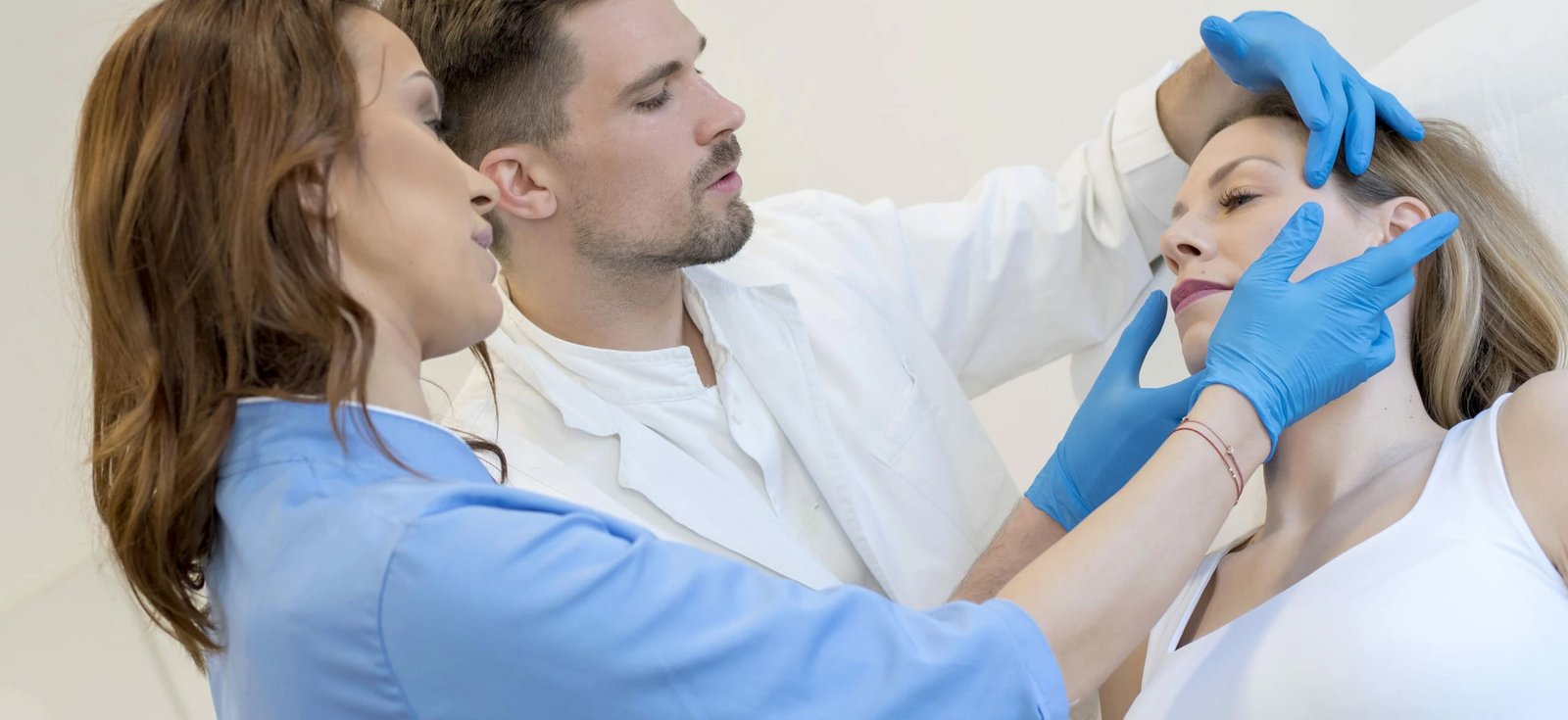 doctors-checking-the-face-of-a-patient-before-perf-2023-11-27-04-59-27-utc-1-1 (1)